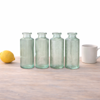 Blumenvase im 4er Set aus Glas in Flaschenform - Salbeigrün