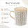 Steingutbecher Reactive Glaze Grau mit Blattmuster